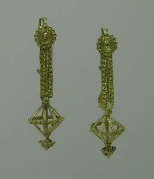 3D cross on a gold pendant